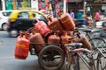 Mumbai, Marhashtra, India / 15 november, 2018: orange gas tanked transported by bike Royalty Free Stock Photo