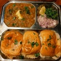 Mumbai Style Pav bhaji is a fast food dish from India, consists of a thick vegetable curry served with a soft bread roll Royalty Free Stock Photo