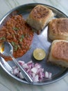 Mumbai Style Pav bhaji is made at home, a fast food dish from India, consists of a thick vegetable curry served with a soft bread Royalty Free Stock Photo