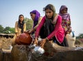 Mumbai women filling water pots