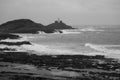 Mumbles Lighthouse lit up on a stormy day overlooking Bracelet Bay, the Gower Peninsula near Swansea, South Wales Royalty Free Stock Photo