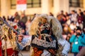 Mummers perform rituals to scare evil spirits at Surva festival at Pernik in Bulgaria. The people with the masks are called Kuker