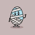 Mummy egg in bandage. Funny comic Easter character of a broken egg. Royalty Free Stock Photo
