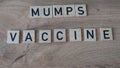 Mumps vaccine concept. Syringe on the table