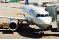 Munchen airport: airplane with passenger boarding bridge