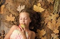 Munching an apple. Organic and natural food for kids health. Small girl likes the taste of apple fruits. Little girl Royalty Free Stock Photo