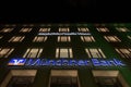 Munchner Bank logo on their Munich main office Munchner Bank Haus taken at night.