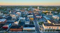 Muncie, IN aerial at sunrise with courthouse and N Walnut St city view at dawn