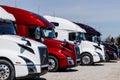 Colorful Volvo Semi Tractor Trailer Trucks Lined up for Sale. Volvo is one of the largest truck manufacturers II Royalty Free Stock Photo