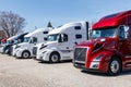 Colorful Volvo Semi Tractor Trailer Trucks Lined up for Sale. Volvo is one of the largest truck manufacturers V Royalty Free Stock Photo