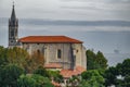 Mundaka church with gas ocean platform in the background Royalty Free Stock Photo