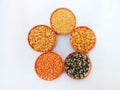 Five types of lentils - mung bean, chickpea lentil, black gram, red masur lentil, and pigeon pea.