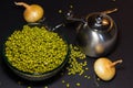 Mung beans, spices, vegetables on a black background