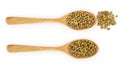 Mung beans in a wooden spoon isolated on white background. Top view Royalty Free Stock Photo