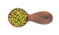 Mung beans in wooden spoon, isolated on white background. Vigna radiata. Top view. Royalty Free Stock Photo