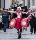 018: A drag queen dressed up like a female red Volkswagen car attending the Gay Pride parade also known as Christopher Street Day