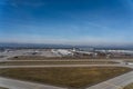 Aerial view of air traffic control Tower, main terminal buildings, taxiways and apron with different types of airplanes - Munich Royalty Free Stock Photo