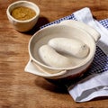 Munich Bavarian traditional white sausages in ceramic pan