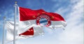 Bayern Munich flag waving with Bundesliga flag on a clear day