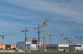 In Munich, Freiham district, many new residential buildings are being built. There are many construction cranes above the houses. Royalty Free Stock Photo