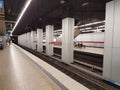 MUNICH, GERMANY - APRIL 2, 2020: A photo of a old subway train arriving to a deserted  Main Trainstation station in Munich Royalty Free Stock Photo