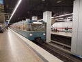 MUNICH, GERMANY - APRIL 2, 2020: A photo of a old subway train arriving to a deserted  Main Trainstation station in Munich Royalty Free Stock Photo