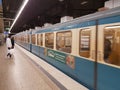 MUNICH, GERMANY - APRIL 2, 2020: A photo of a old subway train arriving to a deserted  Main Trainstation station in Munich Royalty Free Stock Photo