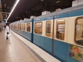 MUNICH, GERMANY - APRIL 2, 2020: A photo of a old subway train arriving to a deserted  Main Trainstation station in Munich Royalty Free Stock Photo