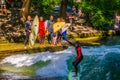 MUNICH, GERMANY, AUGUST 20, 2015: group of surfers is practicing their skill on an artificial wave situated on a small Royalty Free Stock Photo