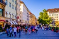 MUNICH, GERMANY, AUGUST 20, 2015: People are walking though a shopping street towards Marienhof in Munich at the Evening