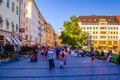 MUNICH, GERMANY, AUGUST 20, 2015: People are walking though a shopping street towards Marienhof in Munich at the Evening