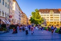 MUNICH, GERMANY, AUGUST 20, 2015: People are walking though a shopping street towards Marienhof in Munich at the Evening