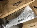 Three Amazon Packages With Logos