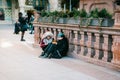 Munich, Germany, December 29, 2016: Two punk girls sit and eat in the central square in Munich. Subculture. Everyday