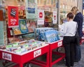 Munich, Germany - girls look for bargains of a book shop