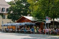 Crowded Bavarian beer garden in the summer with plenty of beer and snacks served Royalty Free Stock Photo