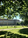 Munich, Germany - July 1, 2018: People sunbathing in the grass in front of Alte Pinakothek