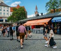 Traditionally dressed Bavarian men at an open air beer garden in Viktualienmarkt in the historic centre of Munich