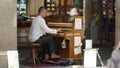 Munich / Germany - June 2019: Ralph Kiefer playing the piano in public near Marienplatz in a beer house in Munich, Germany.