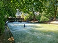 Munich, Germany - 22 June 2024: Surfer at the Eisbach wave in the centre of Munich on the Isar river Royalty Free Stock Photo