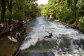 Surfer surfing an artificial wave in Munich city center, Germany. Royalty Free Stock Photo
