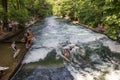 Surfer surfing an artificial wave in Munich city center, Germany. Royalty Free Stock Photo