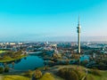 Drone flies over the Olympiapark Munich during sunrise in the morning