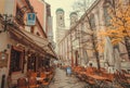 Street with tables of beer bar and 15th century Frauenkirche church Royalty Free Stock Photo