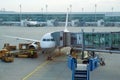 MUNICH, GERMANY - OCTOBER 15, 2016: An airplane at the gate of airport, jetway