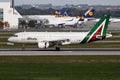 Alitalia Airbus A319 EI-IMH passenger plane arrival and landing at Munich Airport Royalty Free Stock Photo