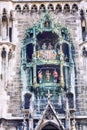 Munich, Germany, 08.20.2015: The old tower on Marianplatz. Puppet show on the facade of the building. Close-up.