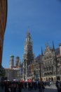 MUNICH, GERMANY - People in Marienplatz on the the famous Town Hall at evening, Munich, Germany.