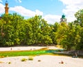 Munich Germany, people relax sun bathing along Isar river in cen