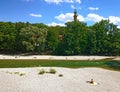Munich Germany, people sun bathing along Isar river in center ci